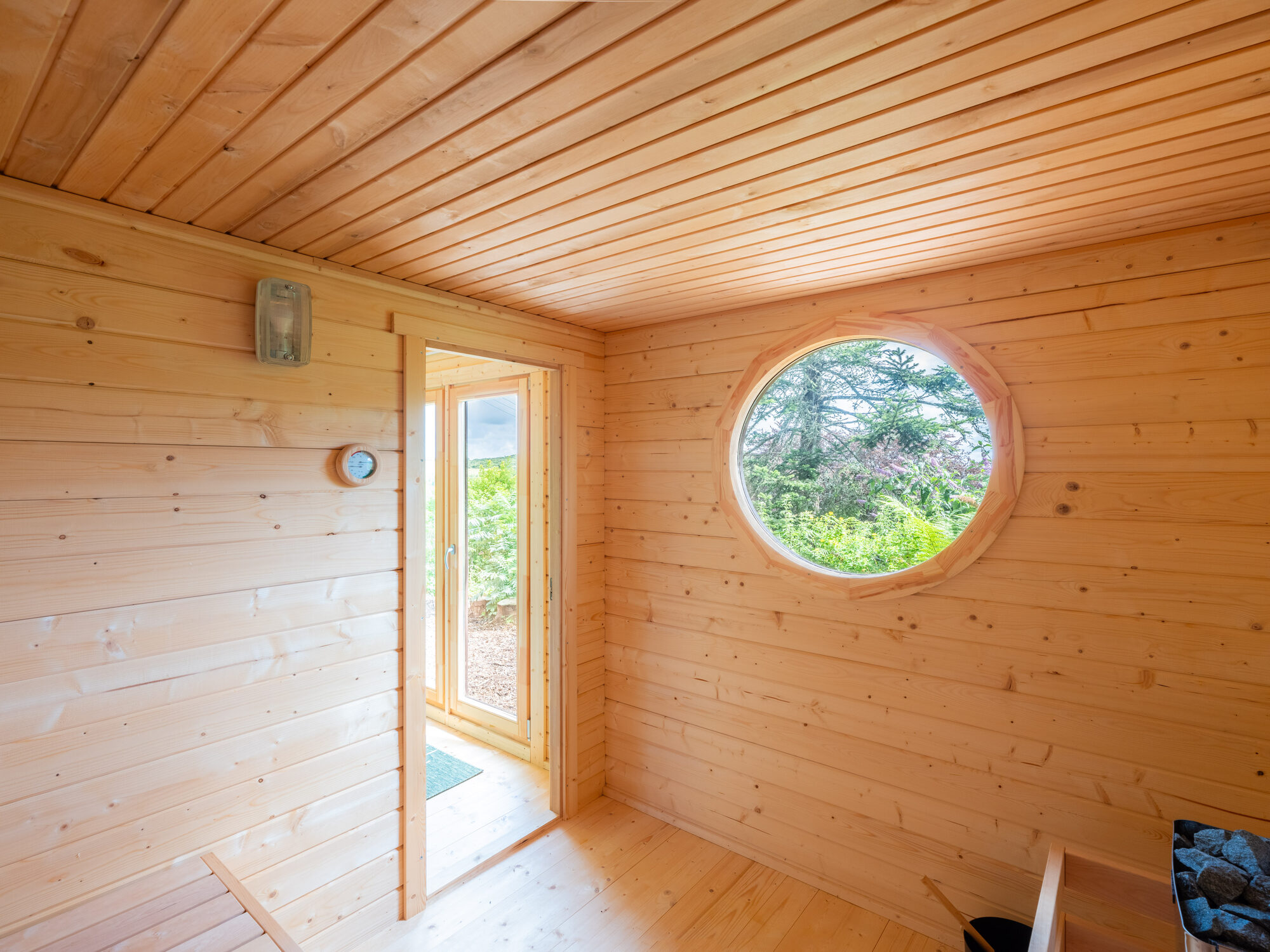 Cedar sauna with its circular window
